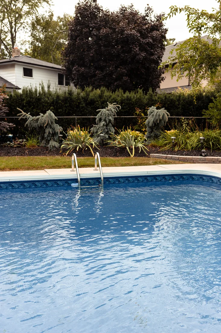 Weekly pool cleaning service for a St. Augustine backyard pool